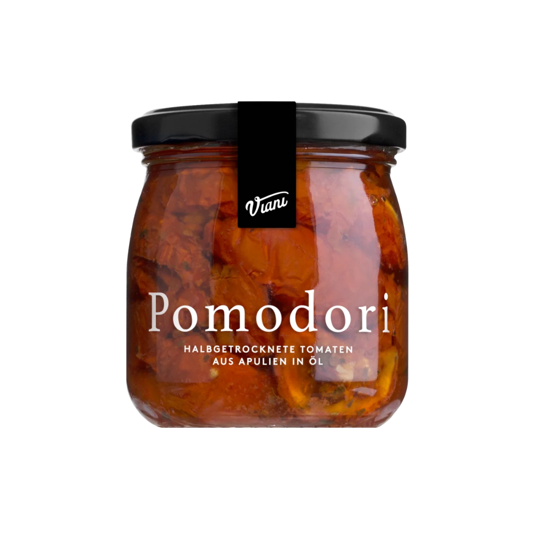 Ein Glas der Marke Viani „Pomodori – halbgetrocknete Tomaten aus Apulien“, das halbgetrocknete Tomaten aus Apulien in Öl enthält. Das Glas hat einen schwarzen Deckel und ein schwarzes Etikett darauf. Der deutsche Text auf dem Glas beschreibt den Inhalt als getrocknete Tomaten in Öl aus Apulien.