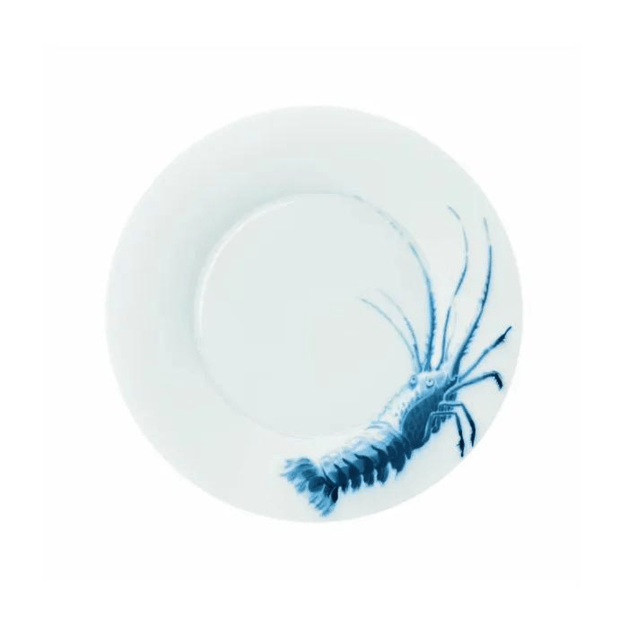 Ein weißer Porzellanteller von Hering Berlin mit einer blauen Abbildung eines Tintenfischs auf der Oberfläche.