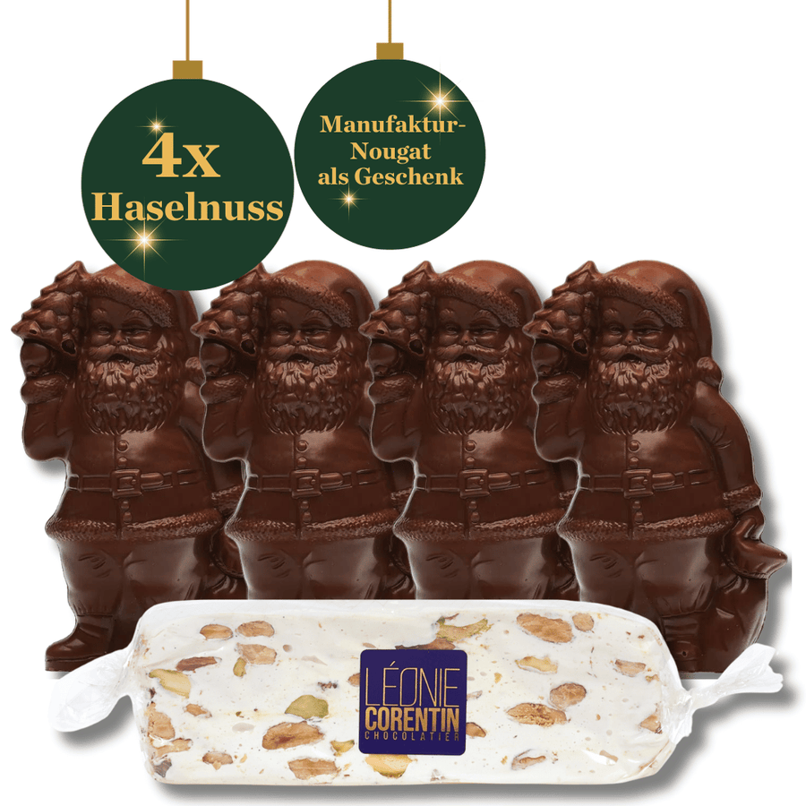 Vier Schokoladen-Weihnachtsmann Haselnuss *Nikolaus-Spezial*-Figuren und eine Tafel Nougat mit Nüssen, mit Etikett „Herstellung – Nougat als Geschenk“ und Anhänger „4x Haselnuss“.
